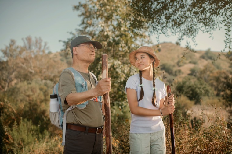 A provider and member walking outdoors together