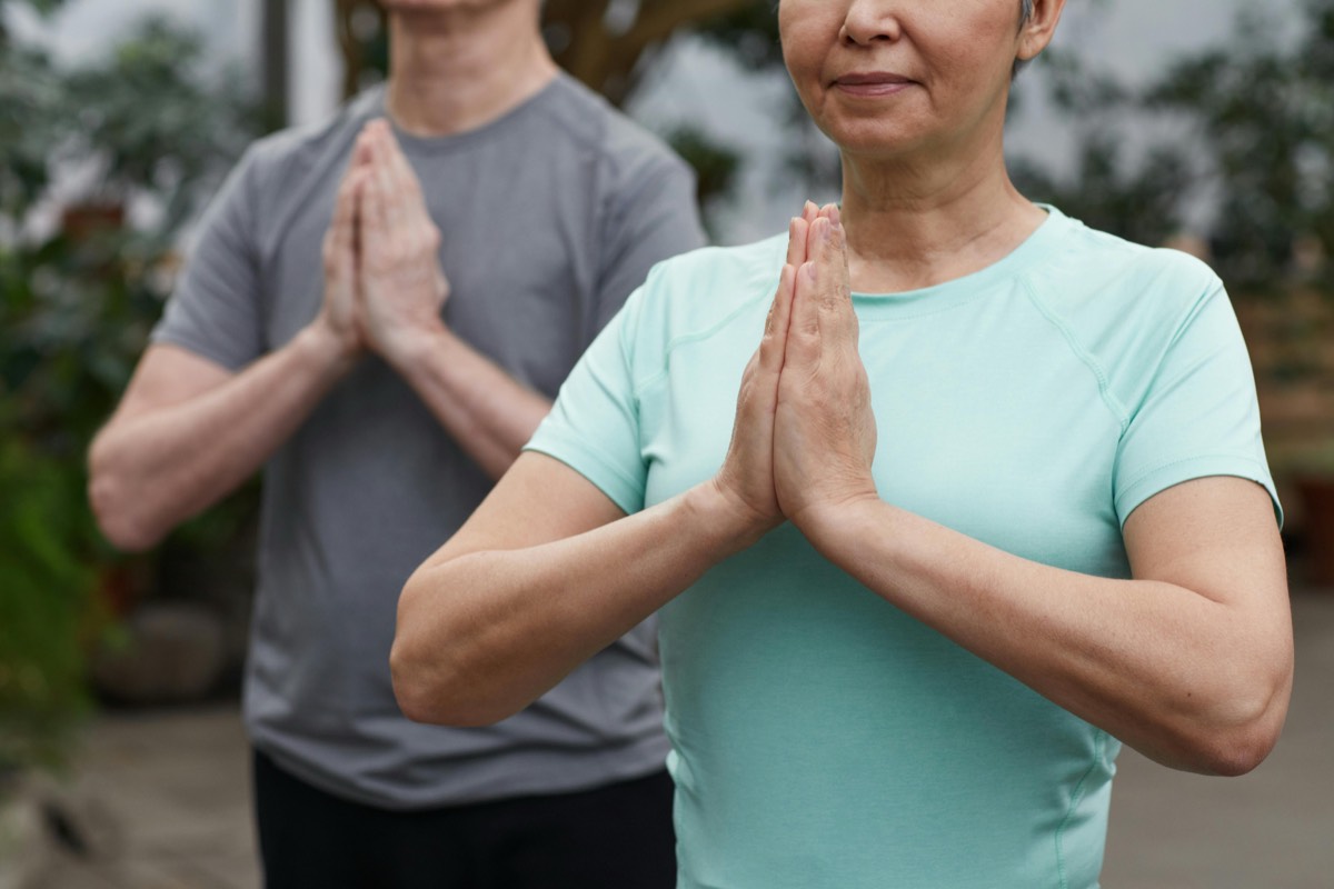 Two members practicing tai chi together
