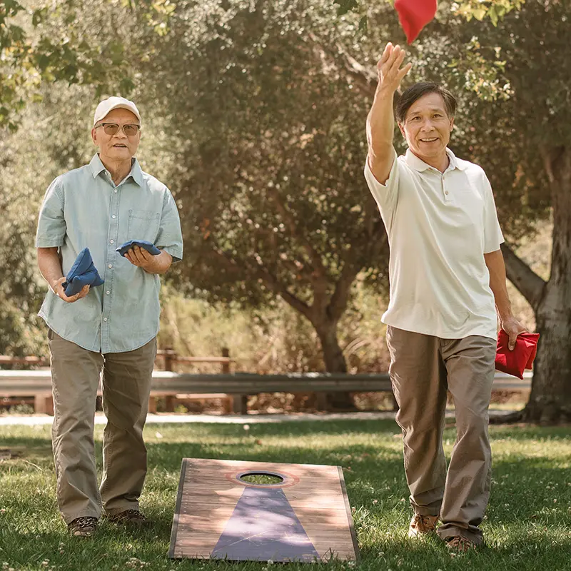 A senior couple taking a selfie outdoors